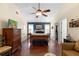 Serene bedroom with a wood bed, a ceiling fan, and access to a closet at 4199 Conway Place Cir, Orlando, FL 32812