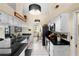Spacious kitchen with white cabinets, black appliances, black countertops, and white tile floors at 4199 Conway Place Cir, Orlando, FL 32812