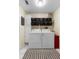 Laundry room with a washer, dryer, shelving, and ample storage space, designed for efficiency and organization in the home at 4199 Conway Place Cir, Orlando, FL 32812
