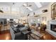 Spacious open-concept living room with high ceilings, skylights, and seamless flow into the kitchen at 4199 Conway Place Cir, Orlando, FL 32812