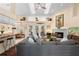 Bright and airy living room with a fireplace, skylights, and an open layout at 4199 Conway Place Cir, Orlando, FL 32812