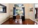 Well-lit home office with a modern desk, comfortable chair, and large window with natural light at 4199 Conway Place Cir, Orlando, FL 32812