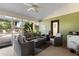 A relaxing screened patio area offering comfortable seating, plants, and a sink at 4199 Conway Place Cir, Orlando, FL 32812