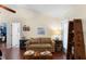 Relaxing sitting area with a comfortable couch, and access to the backyard at 4199 Conway Place Cir, Orlando, FL 32812
