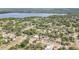 Picturesque aerial view of a lovely home surrounded by lush greenery and tranquil neighborhood streets at 451 E 5Th St, Chuluota, FL 32766