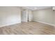Spacious bedroom features wood-look floors and neutral walls at 451 E 5Th St, Chuluota, FL 32766