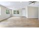 Bright open living room with hardwood floors and lots of natural light at 451 E 5Th St, Chuluota, FL 32766