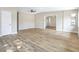Well-lit living room with hardwood floors, offering a spacious atmosphere at 451 E 5Th St, Chuluota, FL 32766