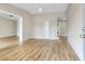 Bright living room with hardwood floors and modern lighting fixtures at 451 E 5Th St, Chuluota, FL 32766
