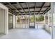 View of the home's screened porch with grey floors and multiple windows at 451 E 5Th St, Chuluota, FL 32766