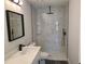 Bathroom featuring marble tile shower, modern vanity, and black fixtures at 4529 Sw 169Th Pl, Ocala, FL 34473
