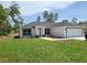 Charming single-story home featuring a well-manicured lawn and a two-car garage at 4529 Sw 169Th Pl, Ocala, FL 34473