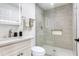 Full bathroom featuring a shower with glass doors, a toilet, and a stylish vanity at 4922 Huppel Ave, Orlando, FL 32811