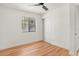 Bedroom showcasing hardwood floors, a ceiling fan, and a closet at 4922 Huppel Ave, Orlando, FL 32811