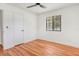 Bedroom showcasing hardwood floors, a ceiling fan, and a closet at 4922 Huppel Ave, Orlando, FL 32811