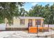 Charming single-story home with a freshly painted exterior and inviting front porch with new steps at 4922 Huppel Ave, Orlando, FL 32811