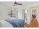 Spacious bedroom with en suite bathroom and modern ceiling fan at 4922 Huppel Ave, Orlando, FL 32811