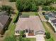 Aerial view of the home showcasing its roof, yard, and surrounding community at 525 Hebrides Ct, Apopka, FL 32712