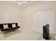 Neutral bedroom featuring a futon, a closet, and carpet flooring at 525 Hebrides Ct, Apopka, FL 32712