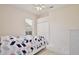 Cozy bedroom with a window, closet and carpet flooring at 525 Hebrides Ct, Apopka, FL 32712