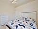 Comfortable bedroom featuring carpet floors and a colorful bedspread at 525 Hebrides Ct, Apopka, FL 32712