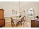 Formal dining room with hardwood floors, chandelier, and well-lit windows at 525 Hebrides Ct, Apopka, FL 32712