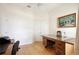 Office space featuring light wood floors, ceiling fan, and a classic wood desk at 525 Hebrides Ct, Apopka, FL 32712