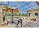 Screened enclosure features a fountain, seating area with a fireplace, and more at 525 Hebrides Ct, Apopka, FL 32712