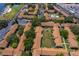 Aerial view showcasing the community amenities including lush lawns and nearby lake access at 5325 Hansel Ave # E-15, Orlando, FL 32809