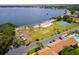 Aerial view of community featuring a boat launch area, tennis courts and lake access at 5325 Hansel Ave # E-15, Orlando, FL 32809