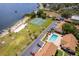 Aerial view of community featuring a pool, tennis courts and lake access at 5325 Hansel Ave # E-15, Orlando, FL 32809