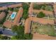 Aerial view highlighting the pool with lounge chairs and the community landscaping at 5325 Hansel Ave # E-15, Orlando, FL 32809
