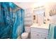 Clean bathroom with decorative shower curtain, vanity, and good lighting at 5325 Hansel Ave # E-15, Orlando, FL 32809