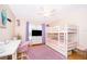 Bright bedroom with bunk beds, desk, and cozy rug, perfect for children or guests at 5325 Hansel Ave # E-15, Orlando, FL 32809