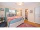 Cozy bedroom with soft lighting, comfortable bed, and en-suite bathroom for added convenience at 5325 Hansel Ave # E-15, Orlando, FL 32809