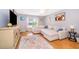 Comfortable living room features modern decor, bright window, and large sectional sofa for relaxation at 5325 Hansel Ave # E-15, Orlando, FL 32809