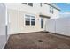 A fenced-in backyard with a brick patio at 6013 Blue Lily Way, Winter Garden, FL 34787