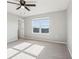 Bright bedroom featuring neutral walls, carpet, and a ceiling fan for comfortable living at 6013 Blue Lily Way, Winter Garden, FL 34787