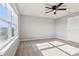 Bedroom featuring a fan and a large window providing ample natural light at 6013 Blue Lily Way, Winter Garden, FL 34787