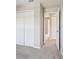Bedroom featuring closet, carpet, and neutral walls at 6013 Blue Lily Way, Winter Garden, FL 34787