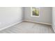 Bedroom with neutral walls, carpet, and a window providing natural light at 6013 Blue Lily Way, Winter Garden, FL 34787