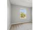 Bedroom with neutral walls, carpet, and a window providing natural light at 6013 Blue Lily Way, Winter Garden, FL 34787