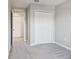 Bedroom featuring closet, carpet, and neutral walls at 6013 Blue Lily Way, Winter Garden, FL 34787