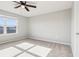 Sunlit bedroom featuring a ceiling fan and neutral carpeting at 6013 Blue Lily Way, Winter Garden, FL 34787