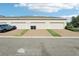 Attached garages with a neat driveway and landscaping at 6013 Blue Lily Way, Winter Garden, FL 34787