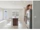 Well-lit kitchen with island and stainless steel appliances, with tile flooring at 6013 Blue Lily Way, Winter Garden, FL 34787