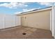 Enclosed brick patio space with a white privacy fence, perfect for outdoor seating and entertaining at 6013 Blue Lily Way, Winter Garden, FL 34787