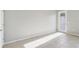 Well-lit room featuring neutral tile flooring and access to the outside, perfect for versatility and comfort at 6013 Blue Lily Way, Winter Garden, FL 34787