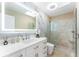 Modern bathroom features a marble wall, spacious walk-in shower, and a stylish vanity with an illuminated mirror at 608 E Club Cir, Longwood, FL 32779
