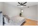 Cozy bedroom with modern ceiling fan and hardwood floors at 608 E Club Cir, Longwood, FL 32779